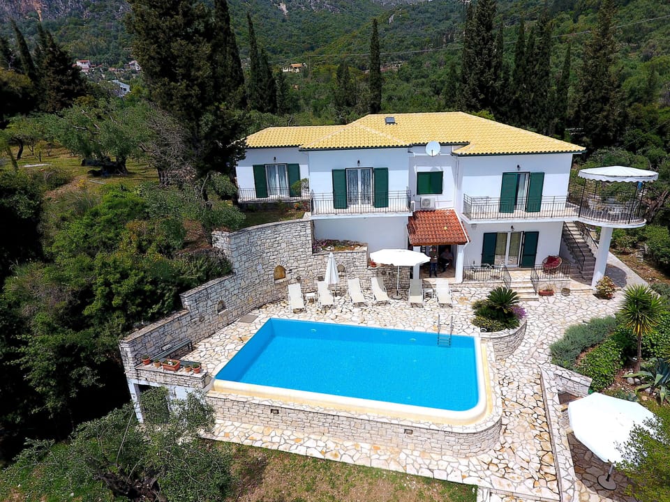 Aerial view of Villa Alexia with private pool and spacious seafront terrace.