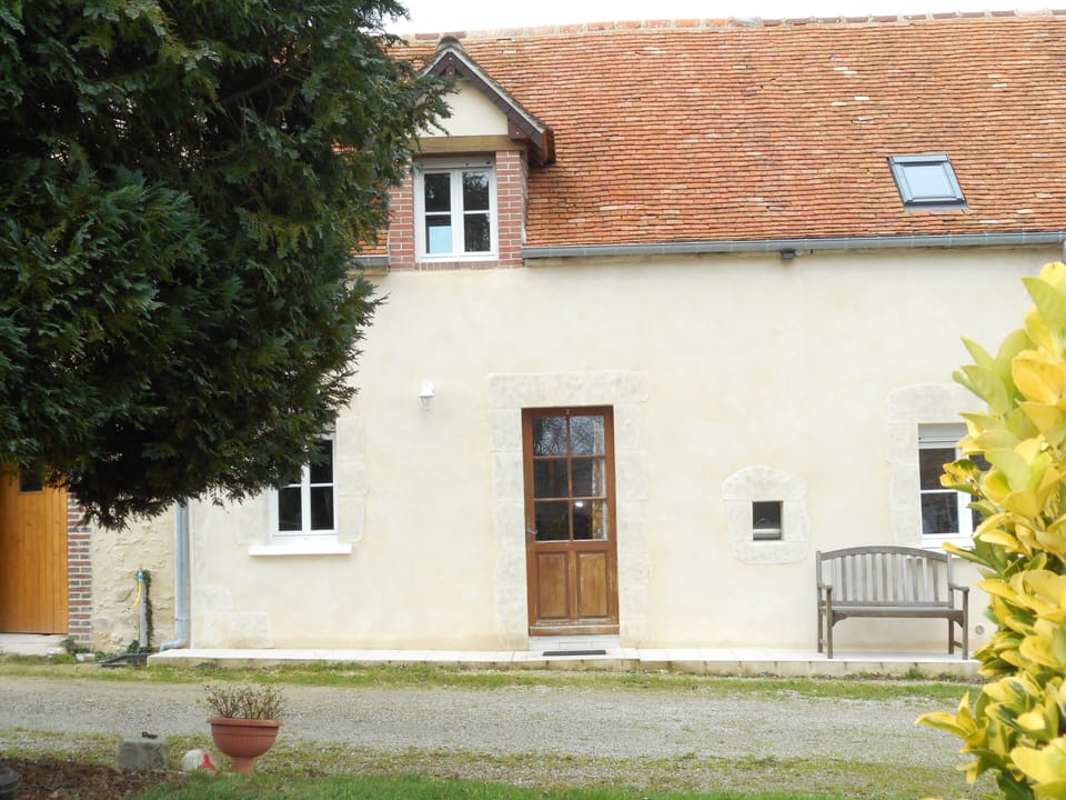 The Cottage, front view from BBQ and exterior personal seating /dining area