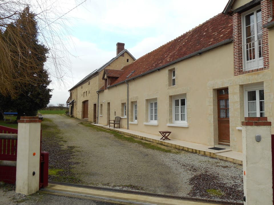 Entrance drive showing 2 gites and longere