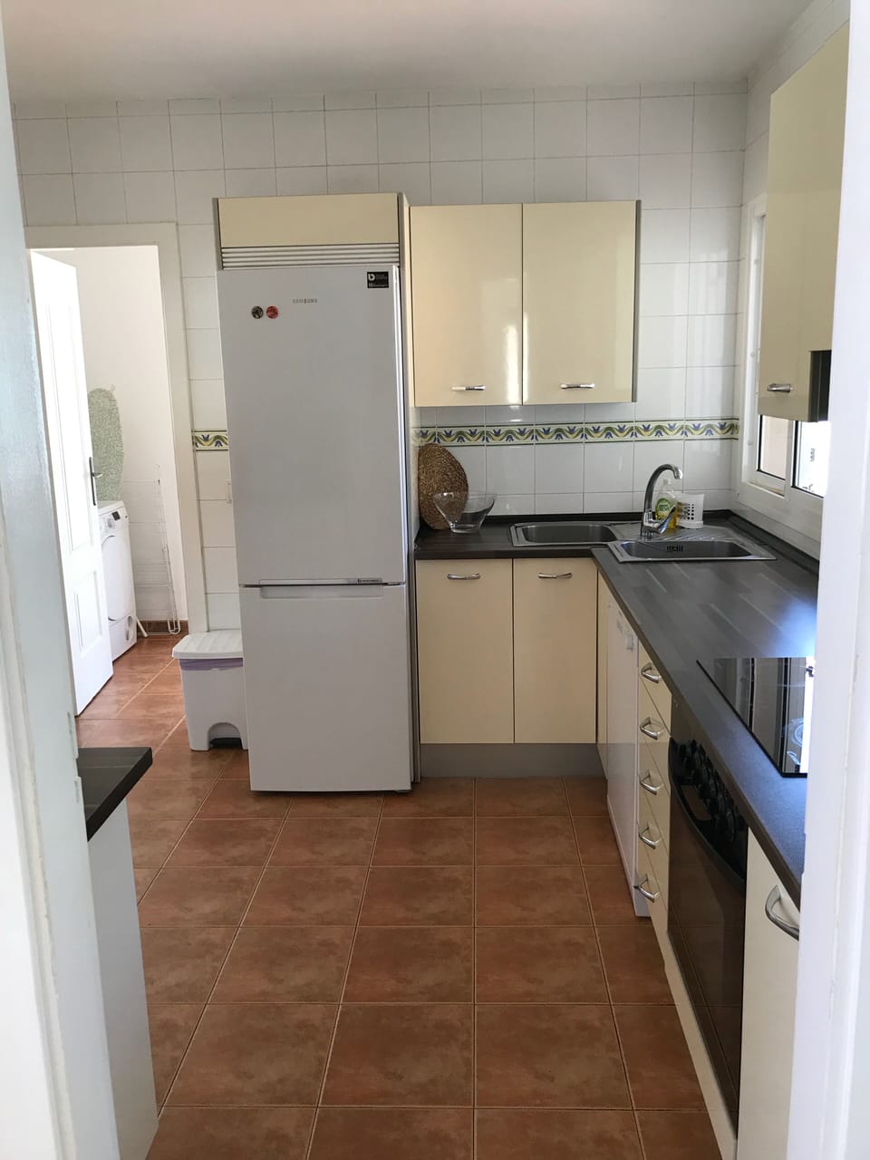 kitchen with view to the laundry room
