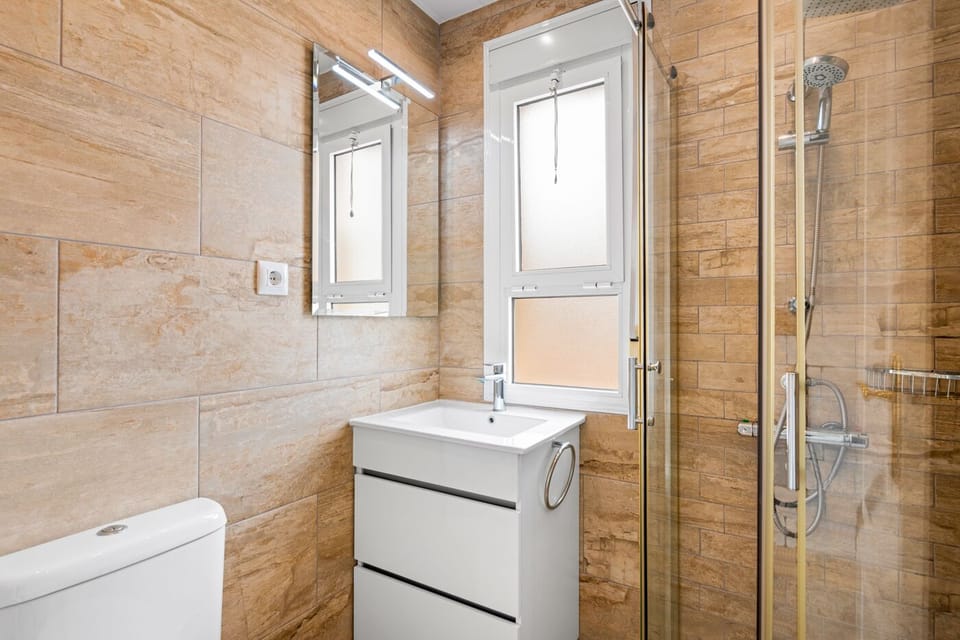 Second bathroom with stand alone shower, modern throughout...