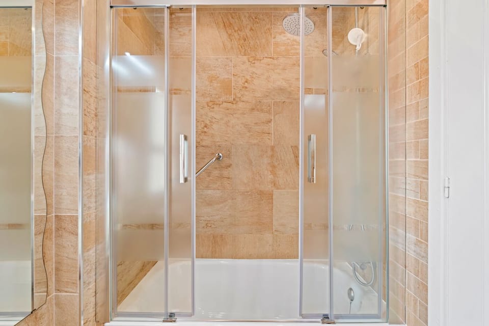 Main bathroom, enclosed shower over bath, modern throughout...