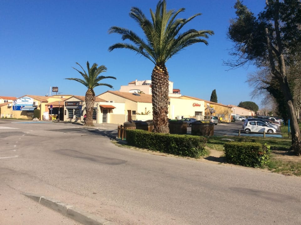 The small shopping complex with bread, fruit & veg, restaurants, take away food