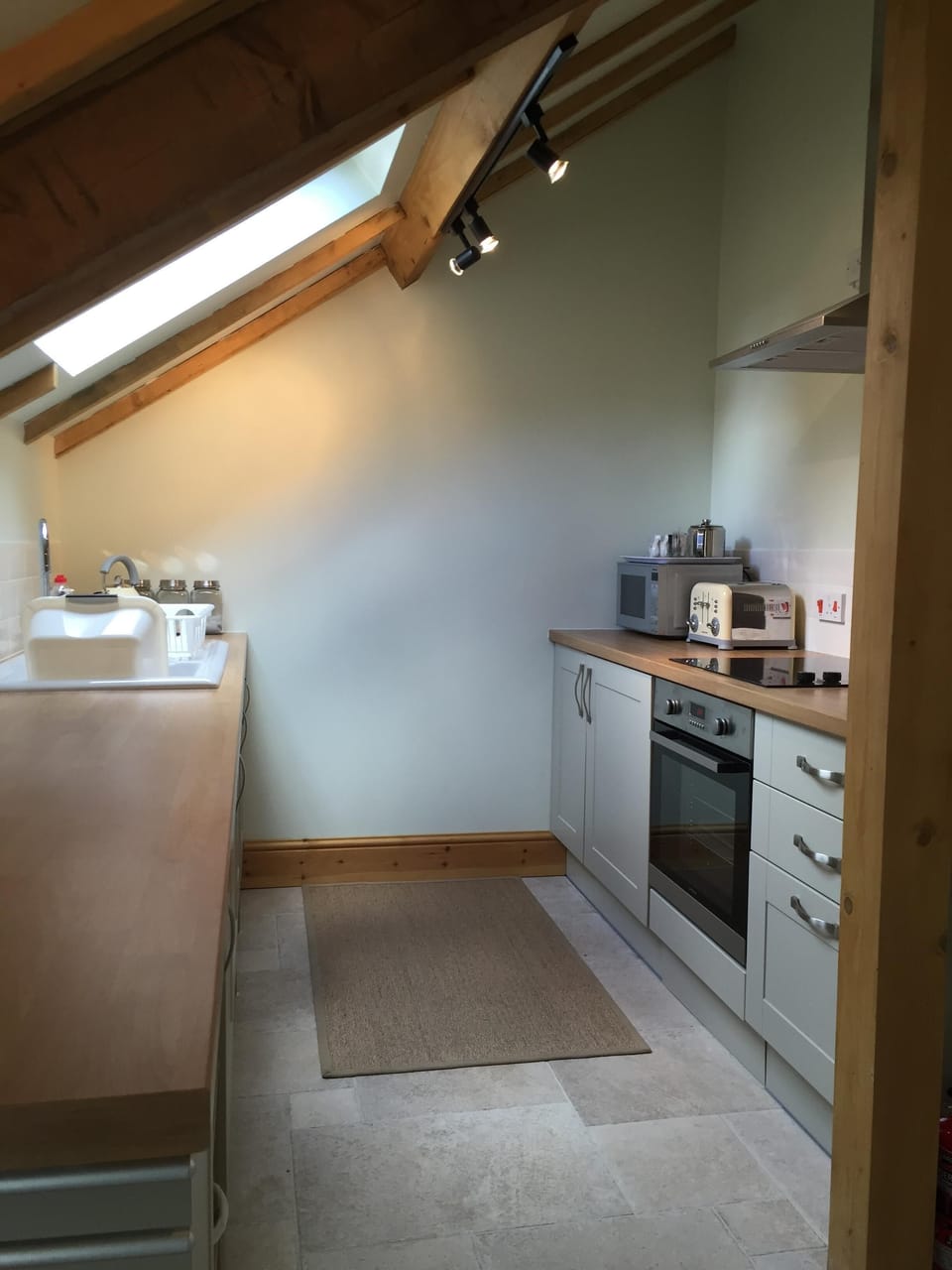fully fitted kitchen with hob, microwave, toaster,dishwasher fridge- freezer etc