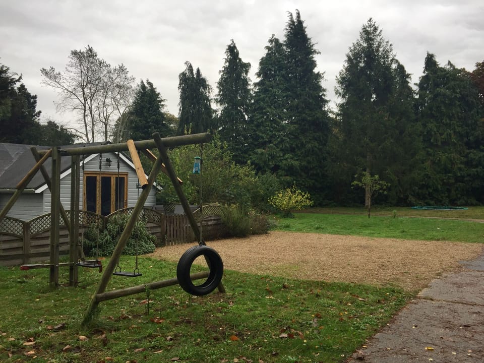 Parking spaces and swings outside Shearer's Cottage.