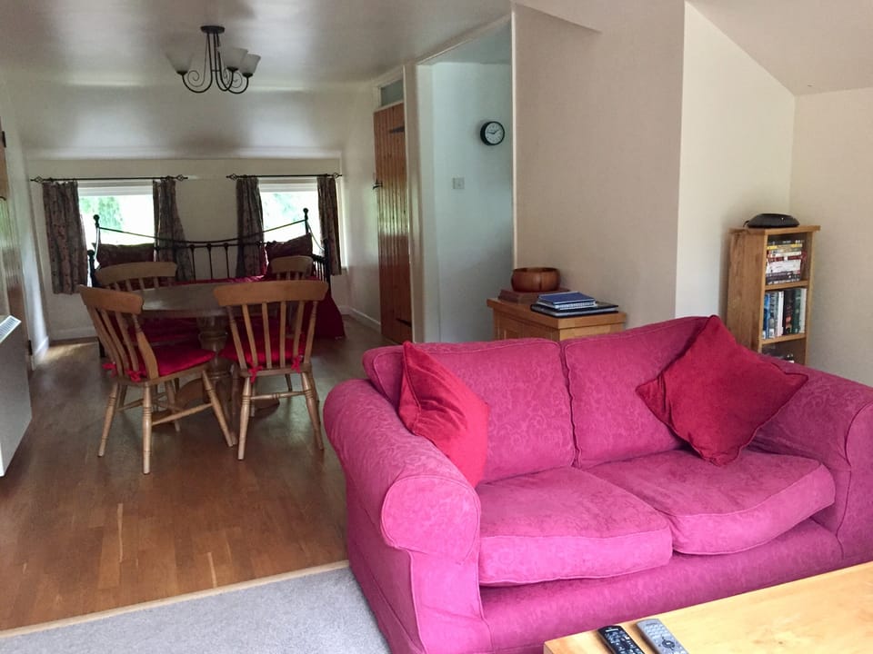 Living room/dining room with day bed which converts to 2 single 3 ft. beds.