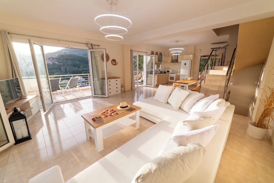 Spacious and sunlit living room with sea views