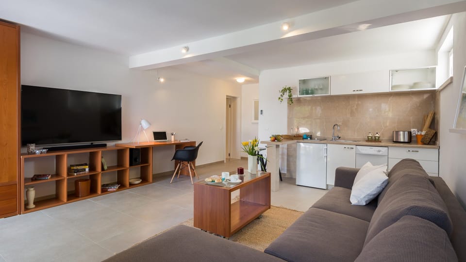 Living room with flat screen satellite TV 