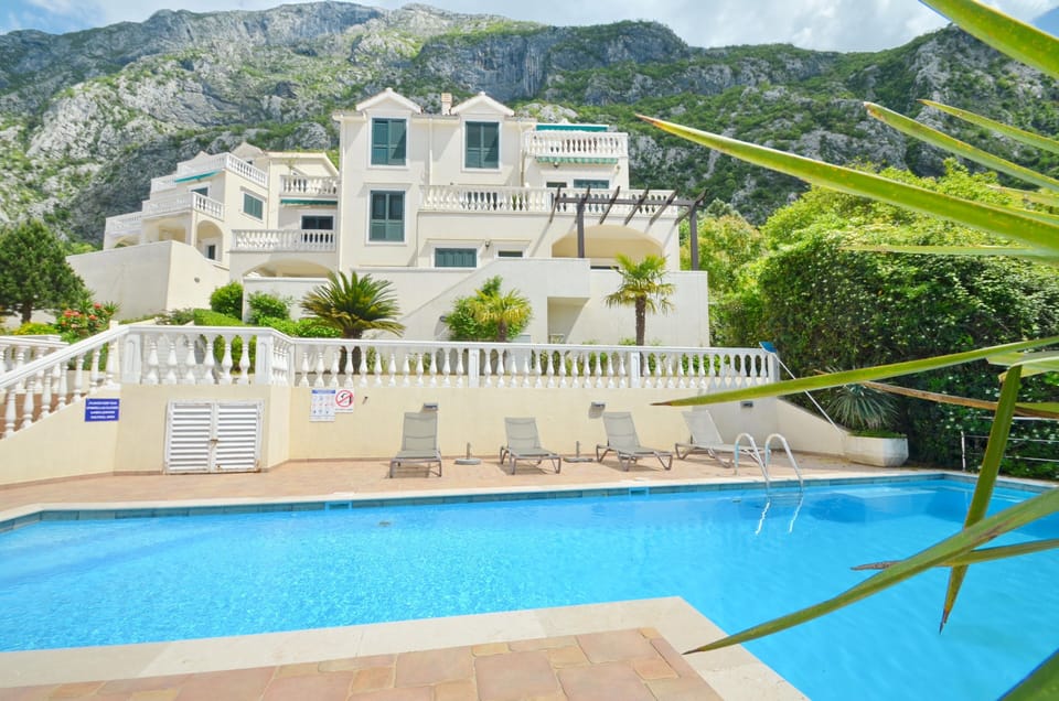 View across the pool towards your apartment on the top right.