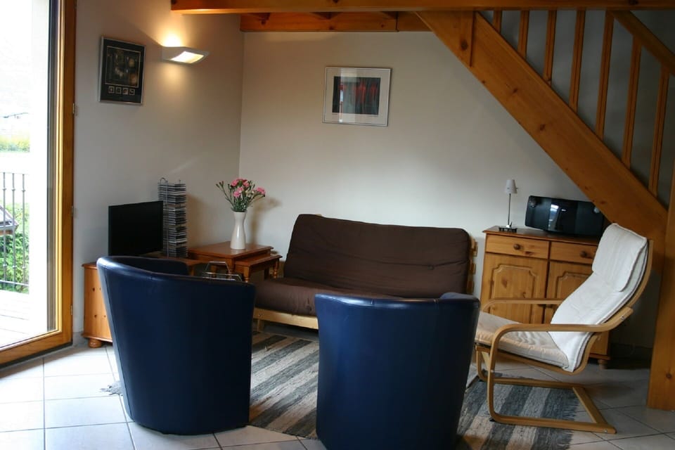 Living Area ... leading to large balcony; TV has UK channels, DVD etc