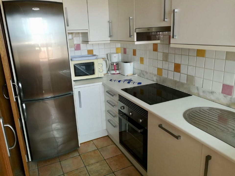 Kitchen area with large fridge/freezer.