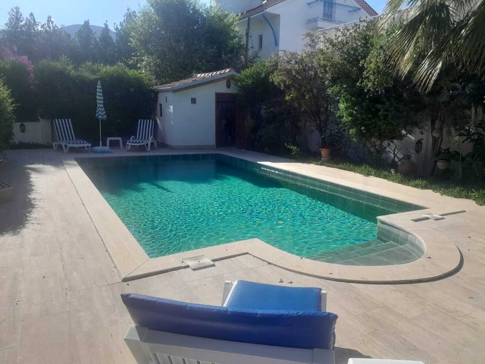 Pool in the afternoon sun, view of the Depot