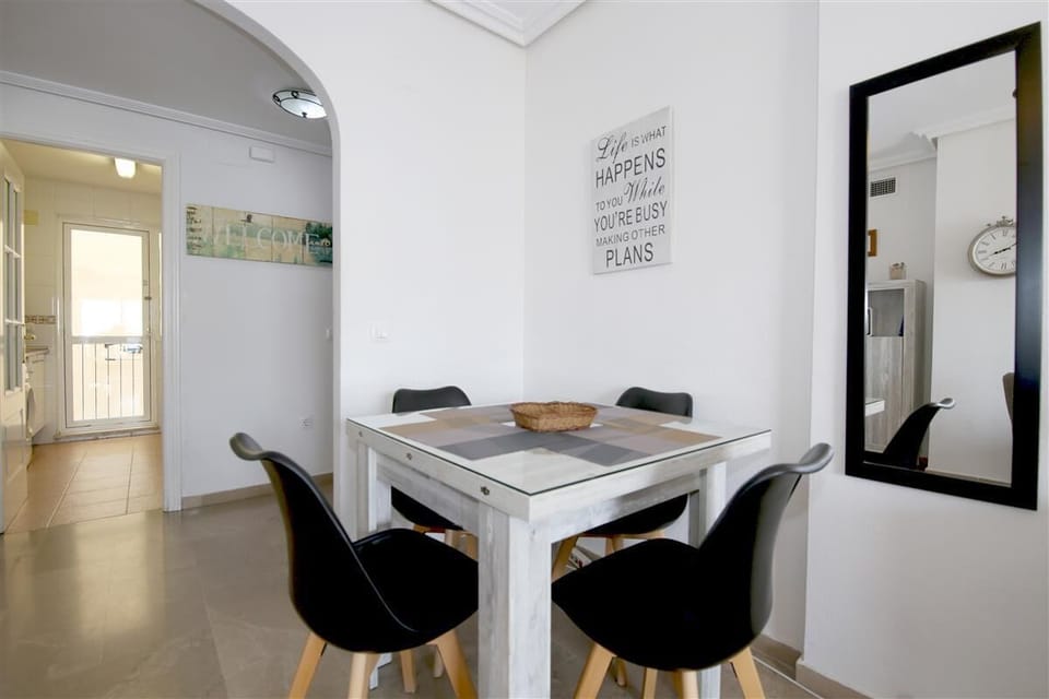 Dining area for four guests on a side of the living room