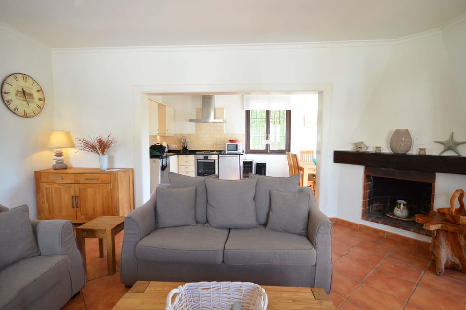 Lounge with kitchen and dining area behind