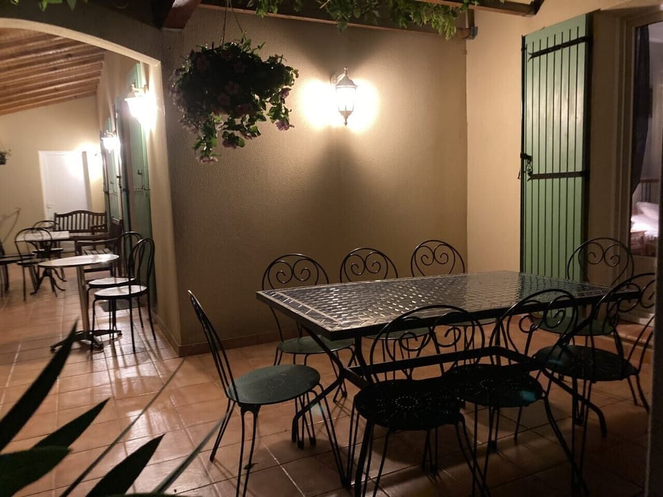 The pergola terrace & the long terrace at night looking towards the back garden