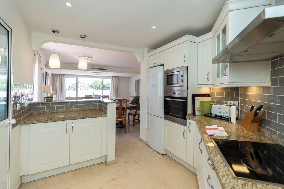 Fully equipped kitchen, large fridge freezer, induction hob, microwave and oven
