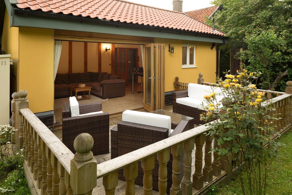 Owl's Hoot private decking area with Rattan garden furniture.