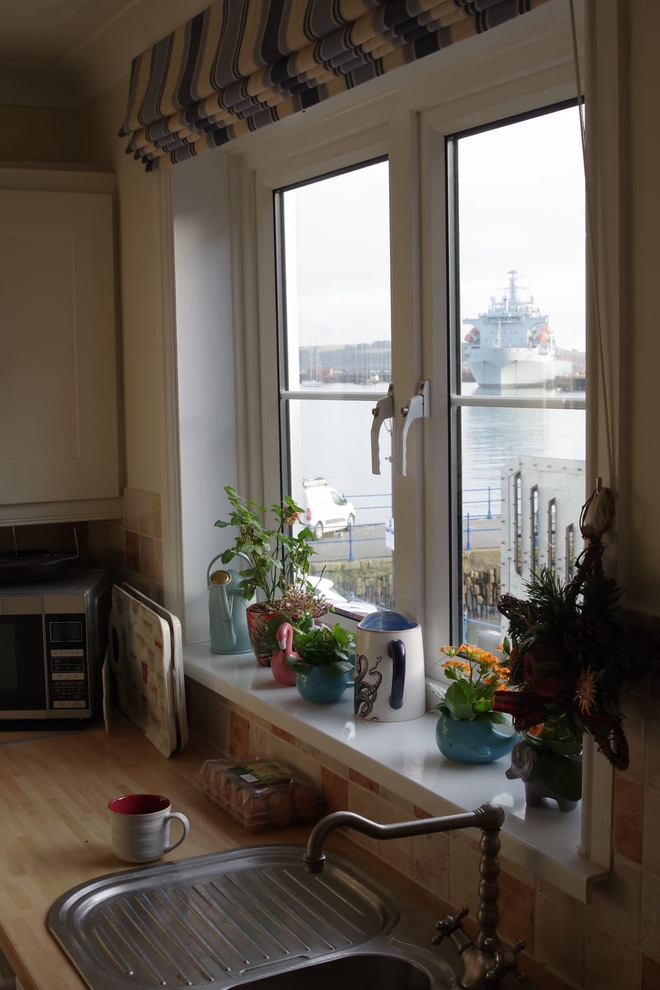 view from kitchen window over Custom House Quay