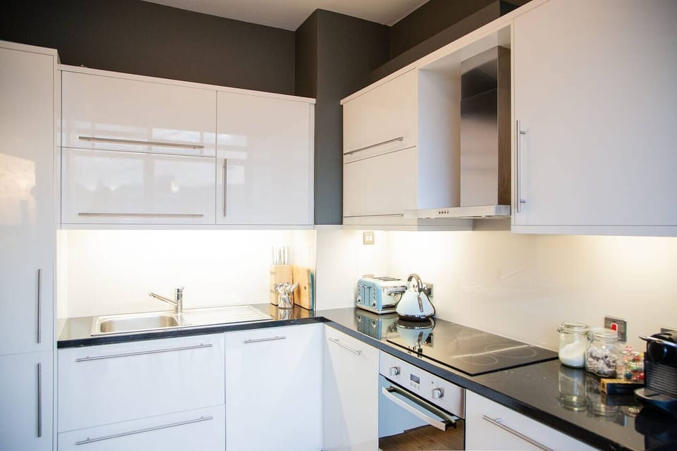 A separate, full kitchen with fridge, freezer, dishwasher, washing machine, clothes dryer, full hob and oven, coffee machine etc