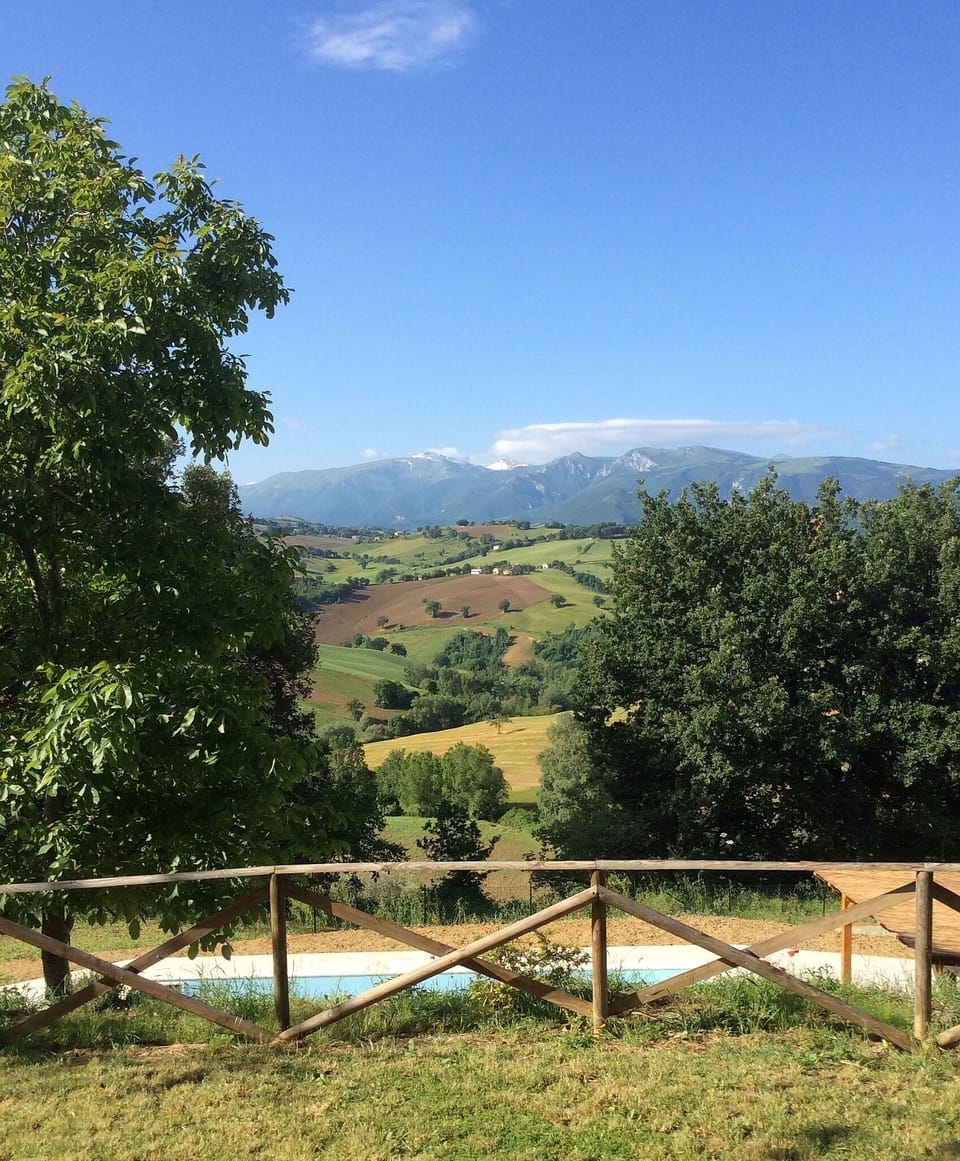 View from the back garden towards the pool below and the Sibillini mountains