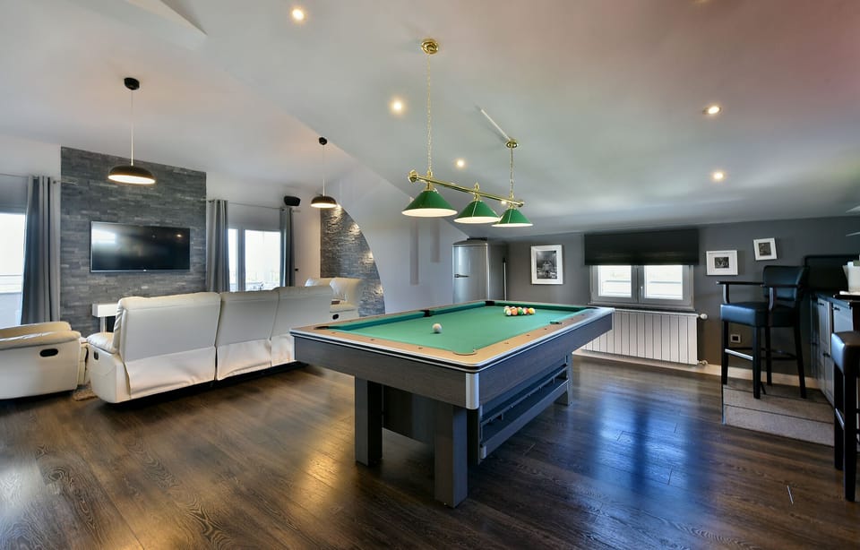 Top floor of the house comes with pool table and spacious living room