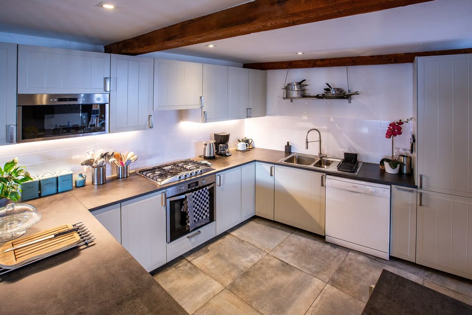 Modern kitchen with dishwasher, microwave, fridge freezer and Wine fridge