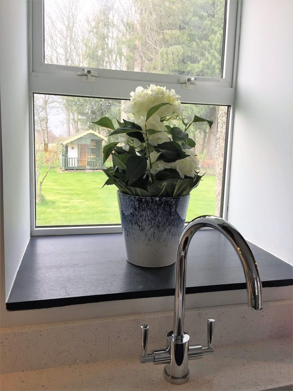 View from the kitchen to the playhouse.
