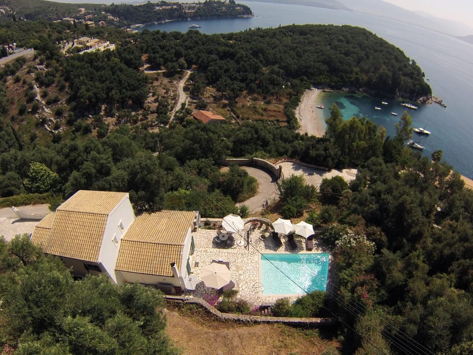 Aerial view of Saranda with Yialiskari beach below and Kalami in the distance