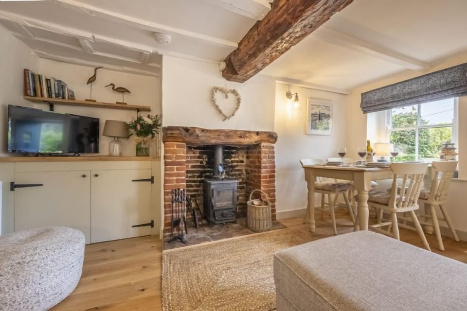 Ground floor: The sitting room features a wood burning stove