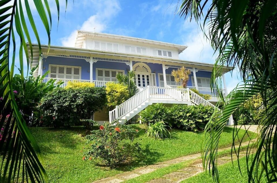 Front entrance of Sweet Breeze set within  tropical gardens.