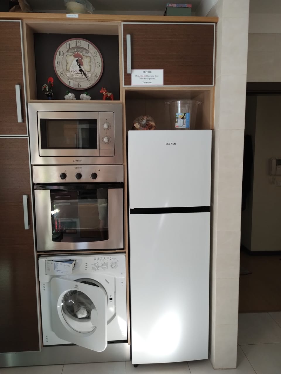 Kitchen with: Fridge/freezer, Fan oven, 
Microwave, Washing machine