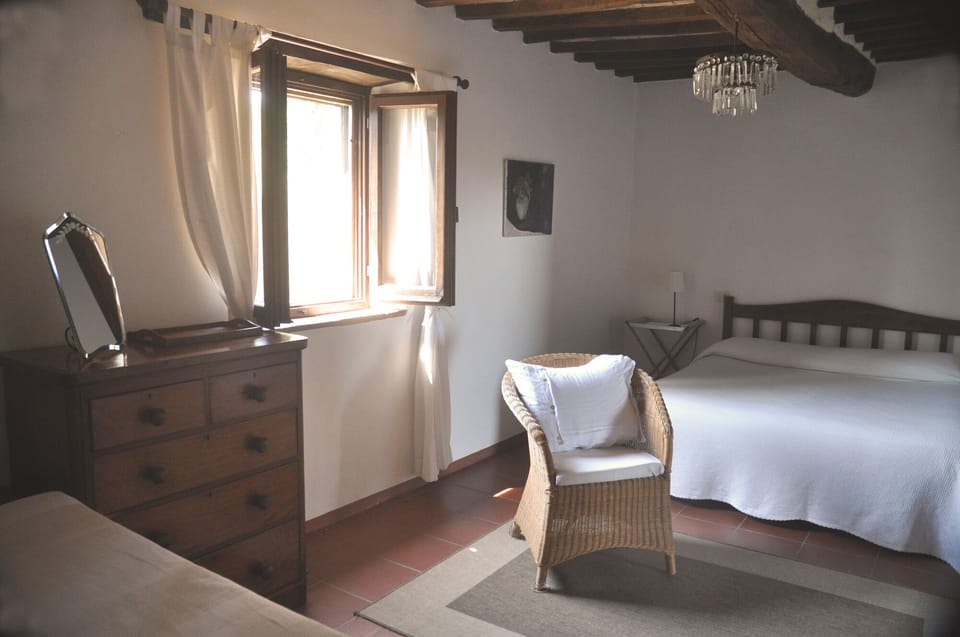 bedroom with ensuite bathroom, daybed and walk-in wardrobe