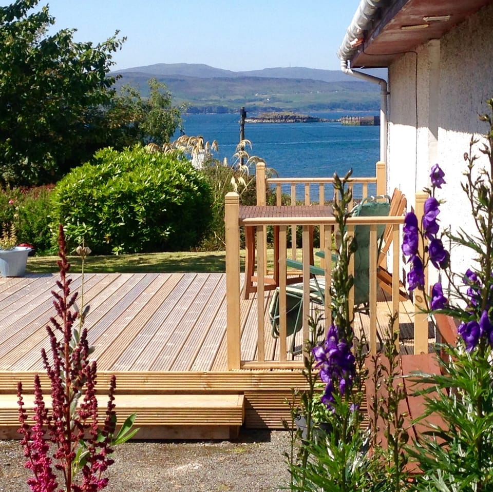 Decking area with table and seating for 8 people