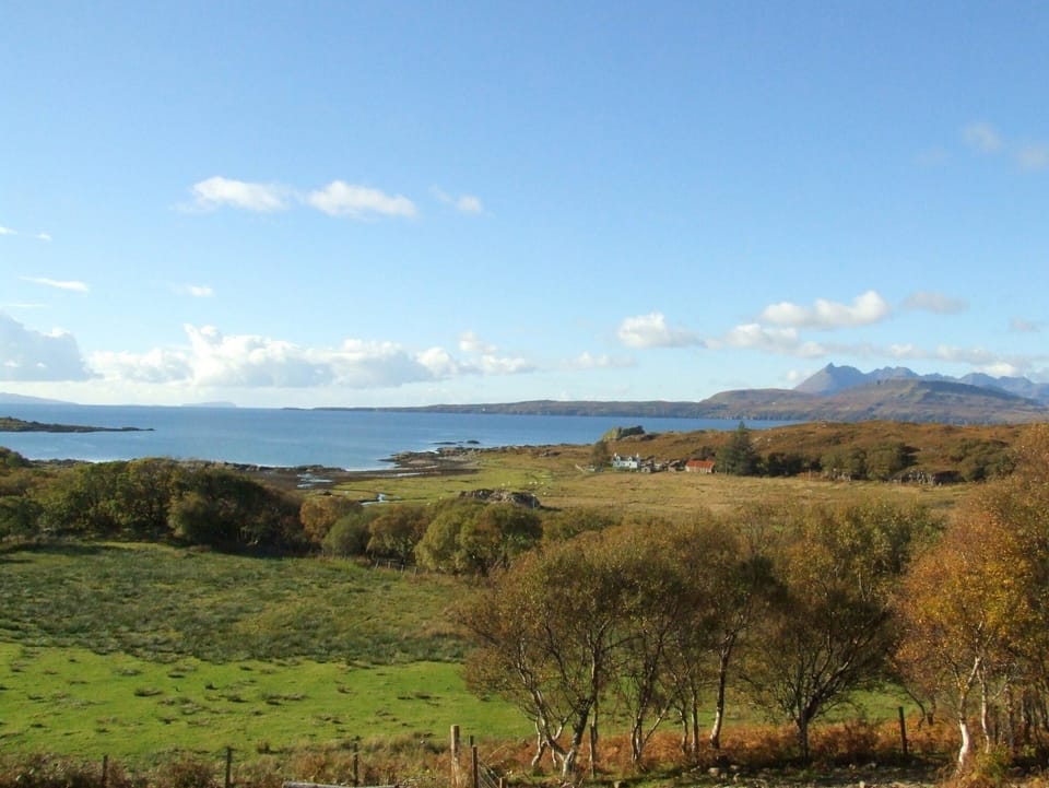 View from the sitting room to Dun Scaith Castle, the loch and the Cuillins.