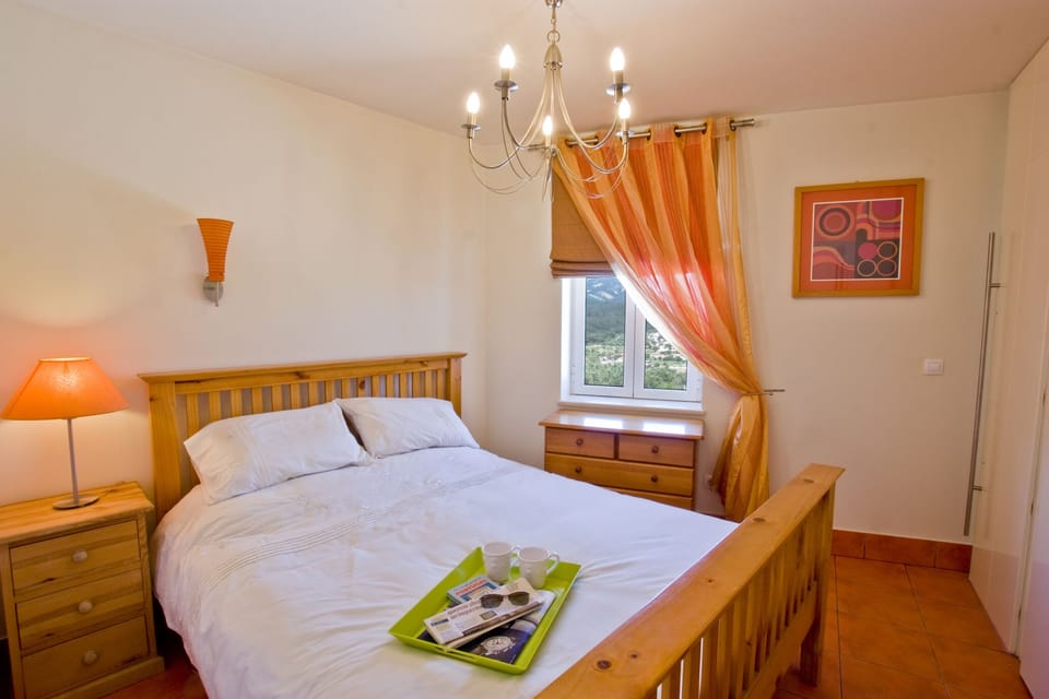Bedroom of apartment 3 with beautiful eastern views over the hilly countryside.