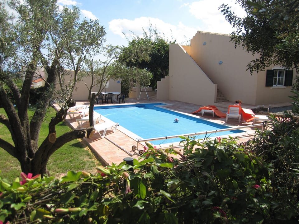 The pool and the back garden from the lane at the side