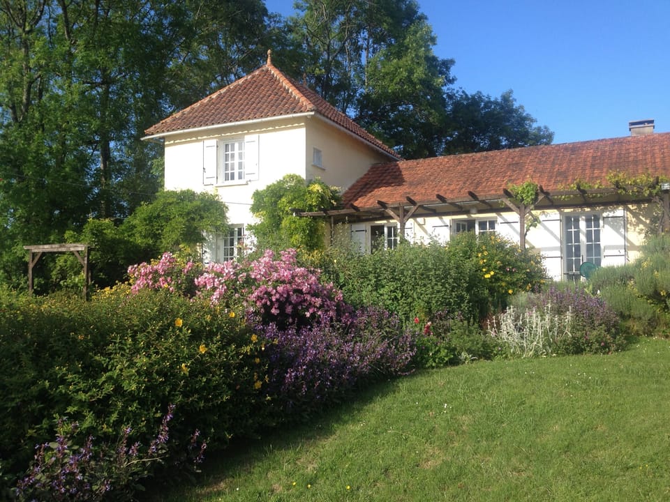 The front of the house and terrace at Margnac