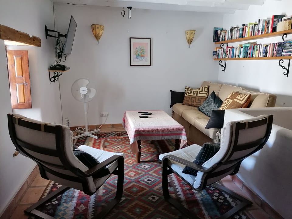 Sitting room with TV, DVD and library