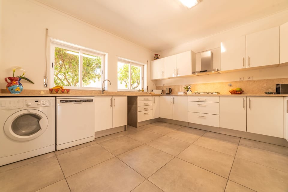 Modern kitchen with cream cabinetry and terracotta tiles — Villa Verdizela II, holiday villa in Verdizela