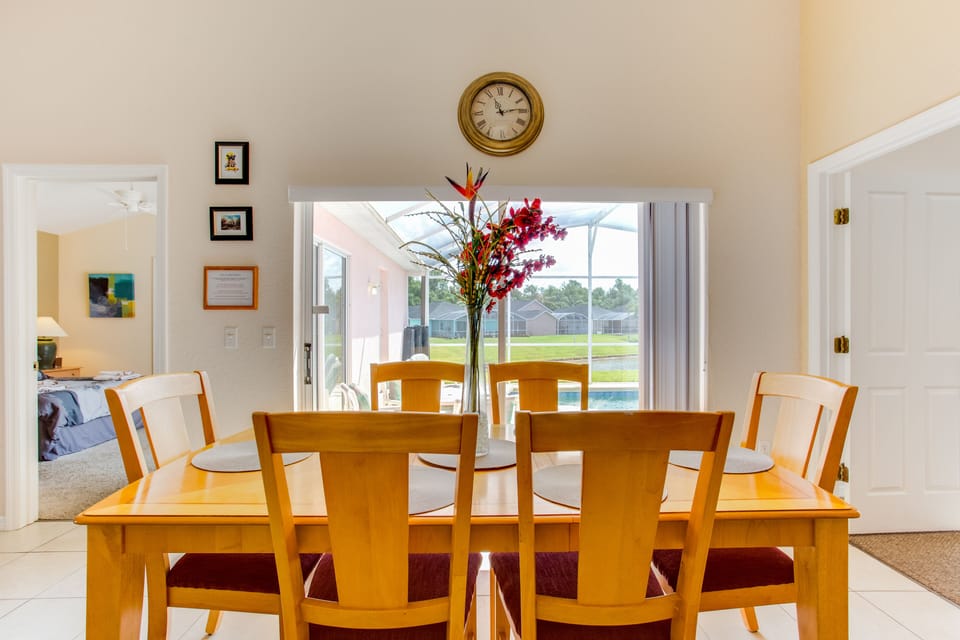 Dining area overlooking pool deck and lake