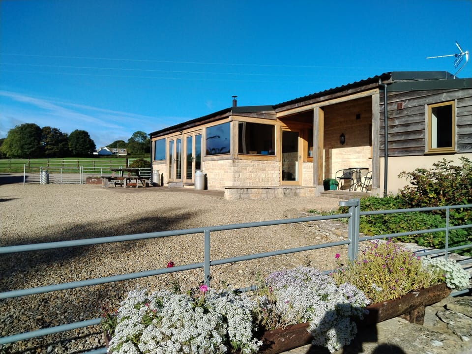 Fenced outdoor area with outdoor furniture.  Plenty of space to park and play! 