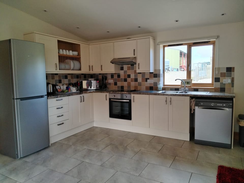 electric oven/hob, fridge/freezer, microwave, full size dishwasher, welcome tray