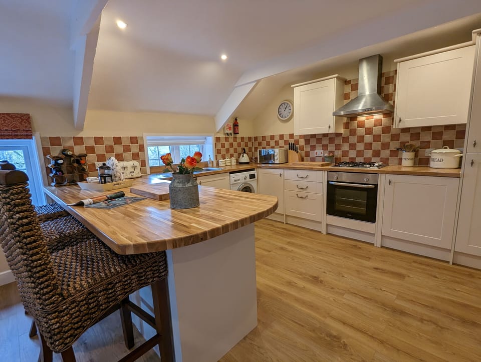 Bright and spacious country kitchen with modern appliances.