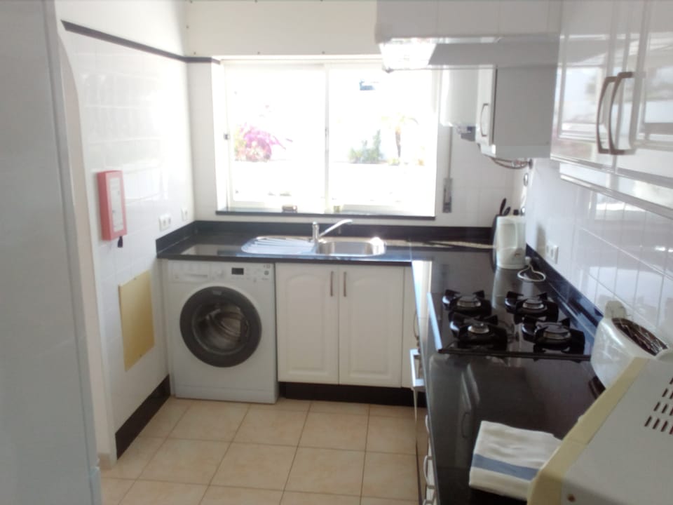 Kitchen with granite work surfaces