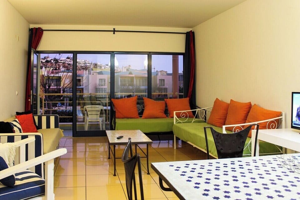 Living room with two single sofa beds and Living room with two single sofa beds and TV with access to balcony