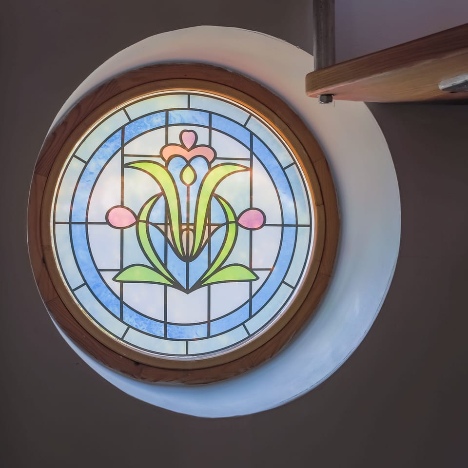 The porthole window gives light and privacy