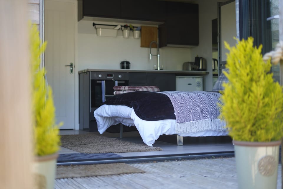 Showing kitchen and sofa bed when made up. 