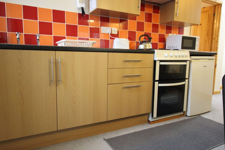 Kitchen has a Gas Oven, Microwave and everything needed to cook and eat in