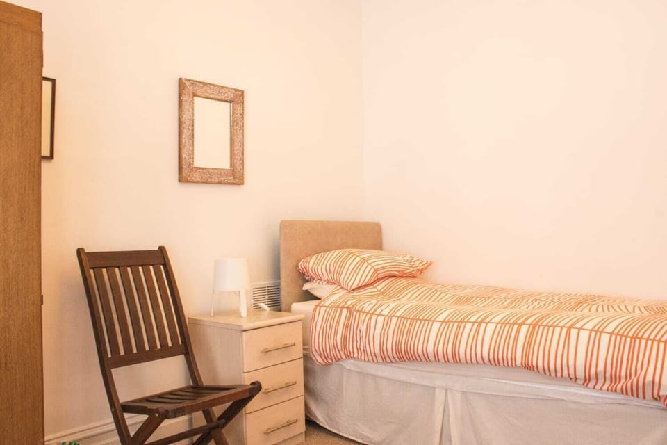 Part of the bedroom which has two single beds