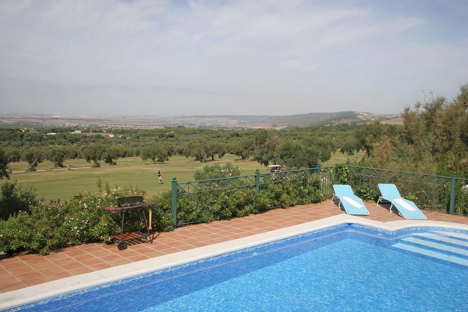 view over pool to golf course